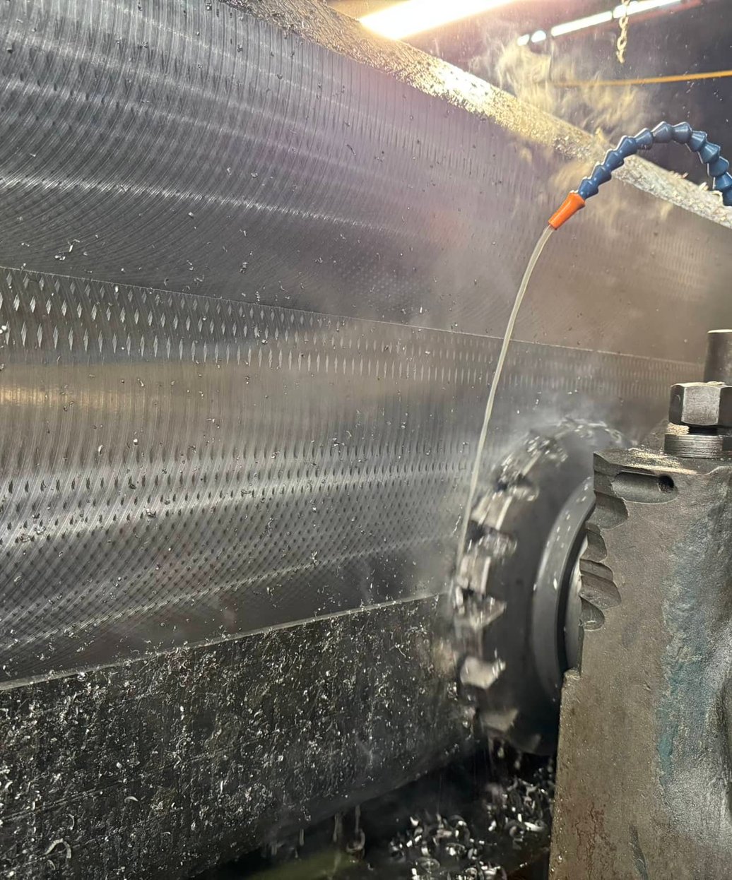 Planer mill removing material from titanium slab