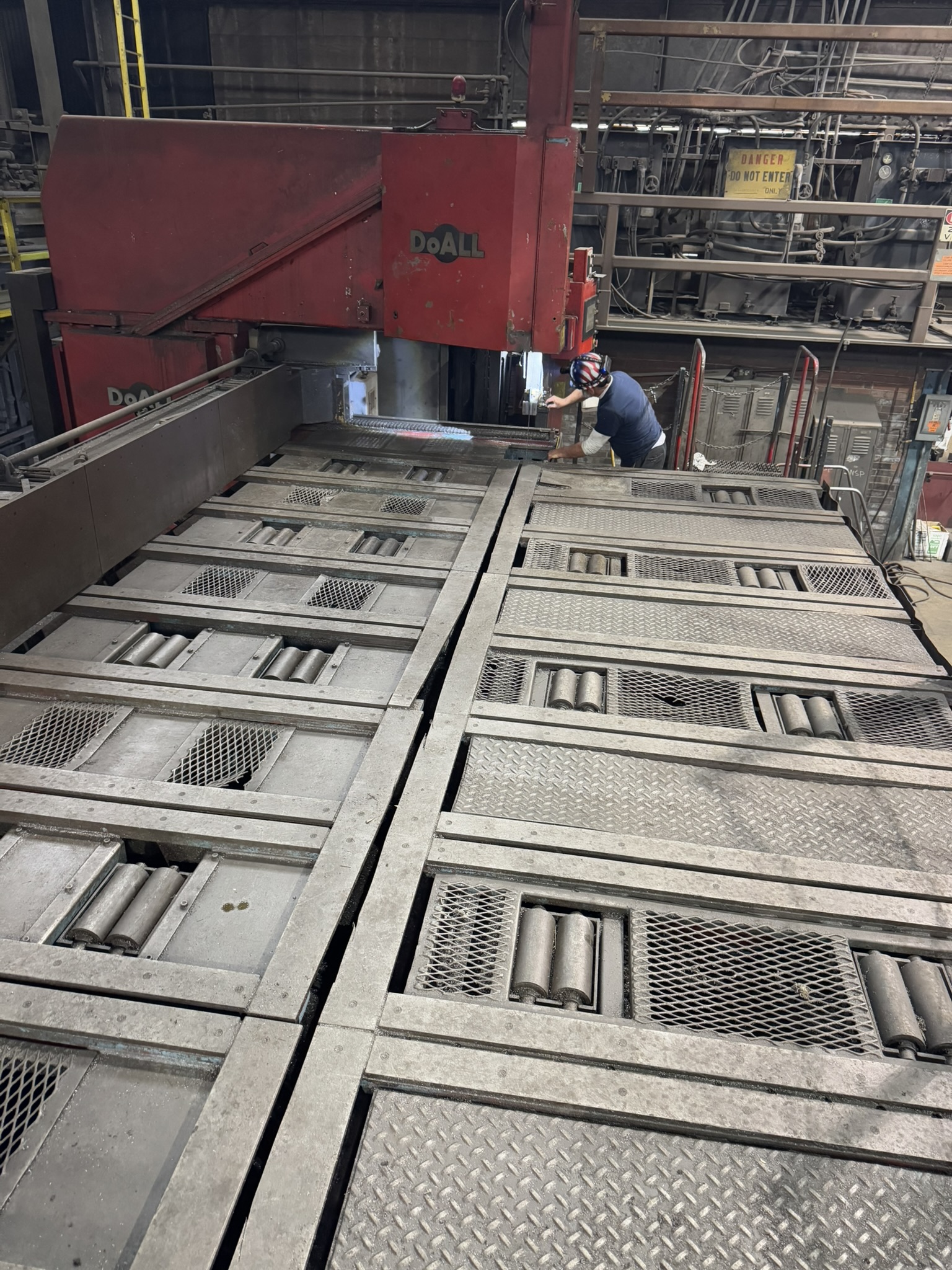 Bandsaw cutting through titanium billet at MSI Corporation